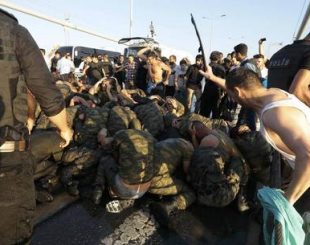 Surrendered Turkish soldiers who were involved in the coup are beaten by civilians on Bosphorus bridge in Istanbul